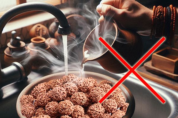 Using very hot or boiling water with Rudraksha.