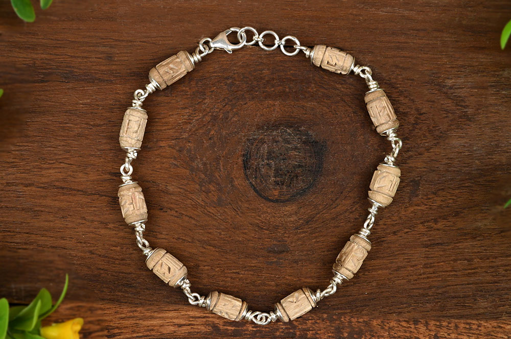Tulsi Radha Carved Drum Shape Beads Silver Caps Bracelet