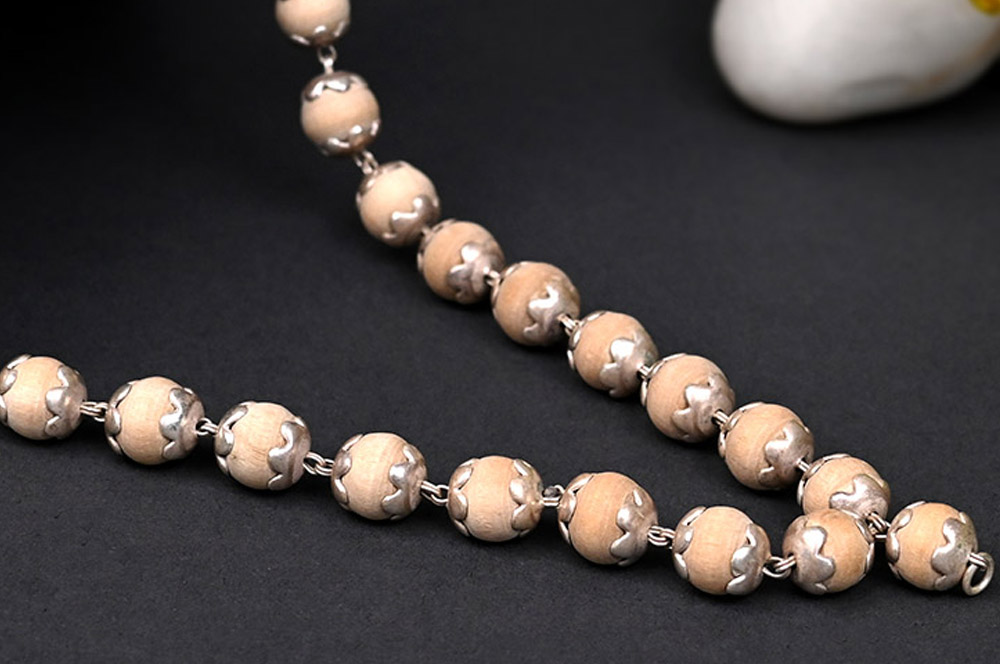 White Tulsi Mala in silver flower caps