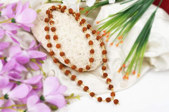 Rudraksha mala - 10mm in gold polished copper caps