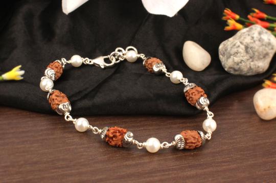 2 mukhi with Pearl bracelet in self designed caps