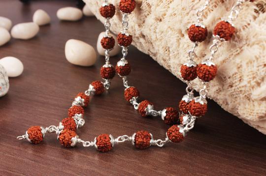 Rudraksha mala in silver flower caps