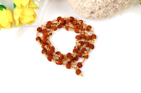 Rudraksha mala - 7 mm in gold polished copper caps