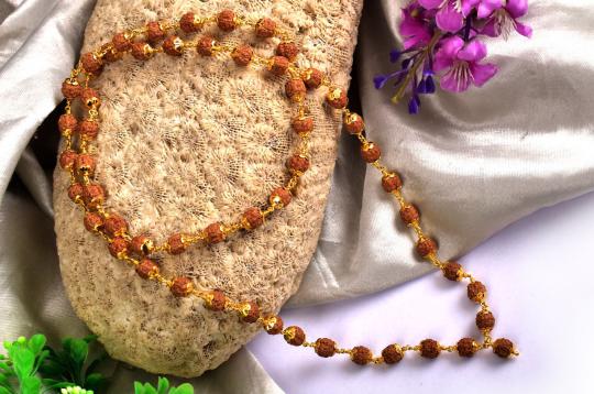 7mm chikna beads mala in gold with designer caps