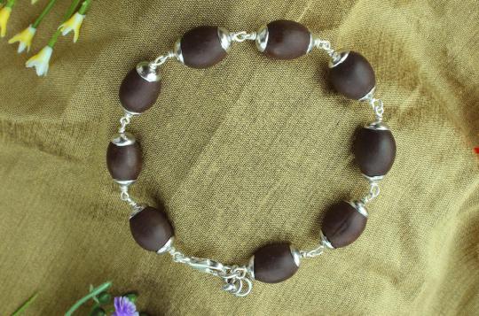 Lotus seed Bracelet in silver caps