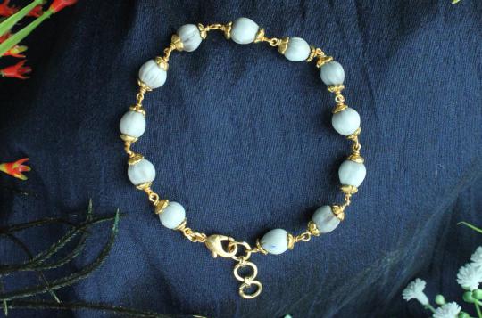 White Vaijayanti Bracelet in Copper Gold Polish flower caps