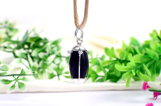 Black Narmada Lingam in silver locket