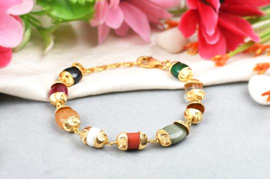 Navratna Bracelet in gold designer caps - Design I