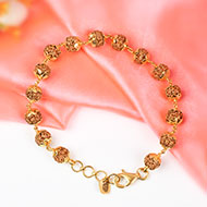 Punch mukhi Chikna bead bracelet with gold flower caps - I