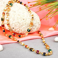 Navratna mala precious gems in gold caps