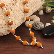 Tumeric mala in silver with caps