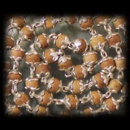 Sandalwood mala in silver with flower caps