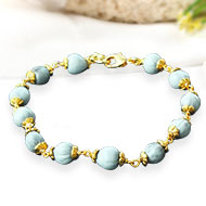 White Vaijayanti Bracelet in Copper Gold Polish flower caps