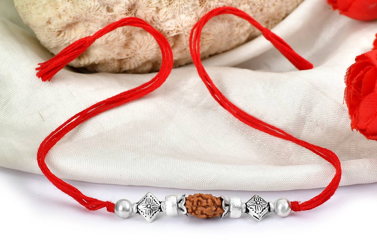 2 mukhi Rakhi with pure silver accessories in thread