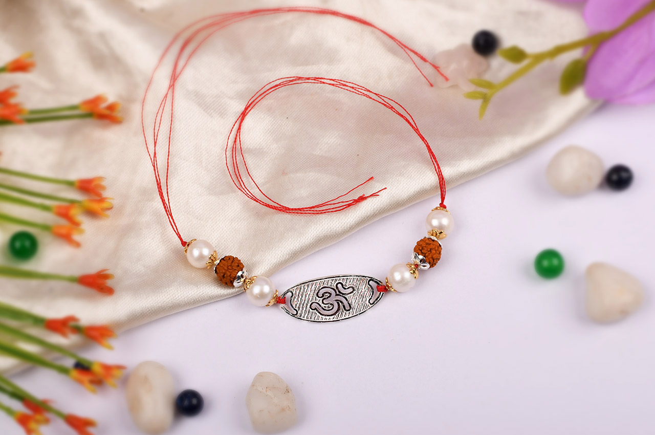 4 Mukhi Rakhi Pearl Beads with pure silver and metal accessories