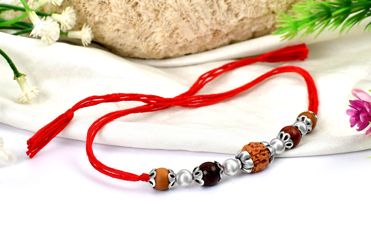 4 Mukhi Rakhi Sandal beads with silver accessories in thread