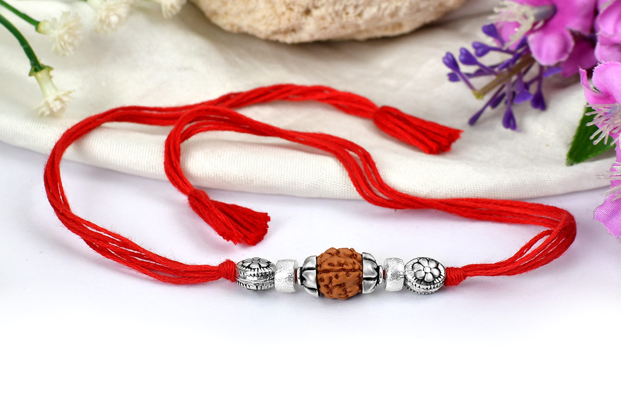 4 mukhi Rakhi with pure silver accessories in thread - I