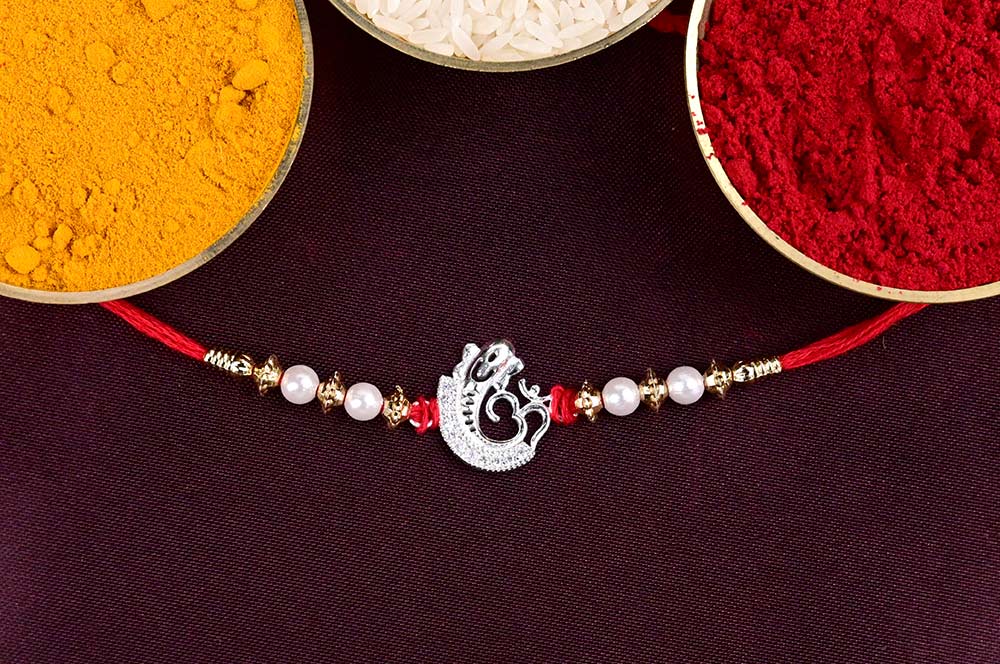 Designer OM Ganesh Rakhi with Pearls in 925 Silver