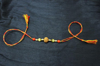 8 Mukhi Rakhi Cats Eye and Coral beads with Panchdhatu Chakris