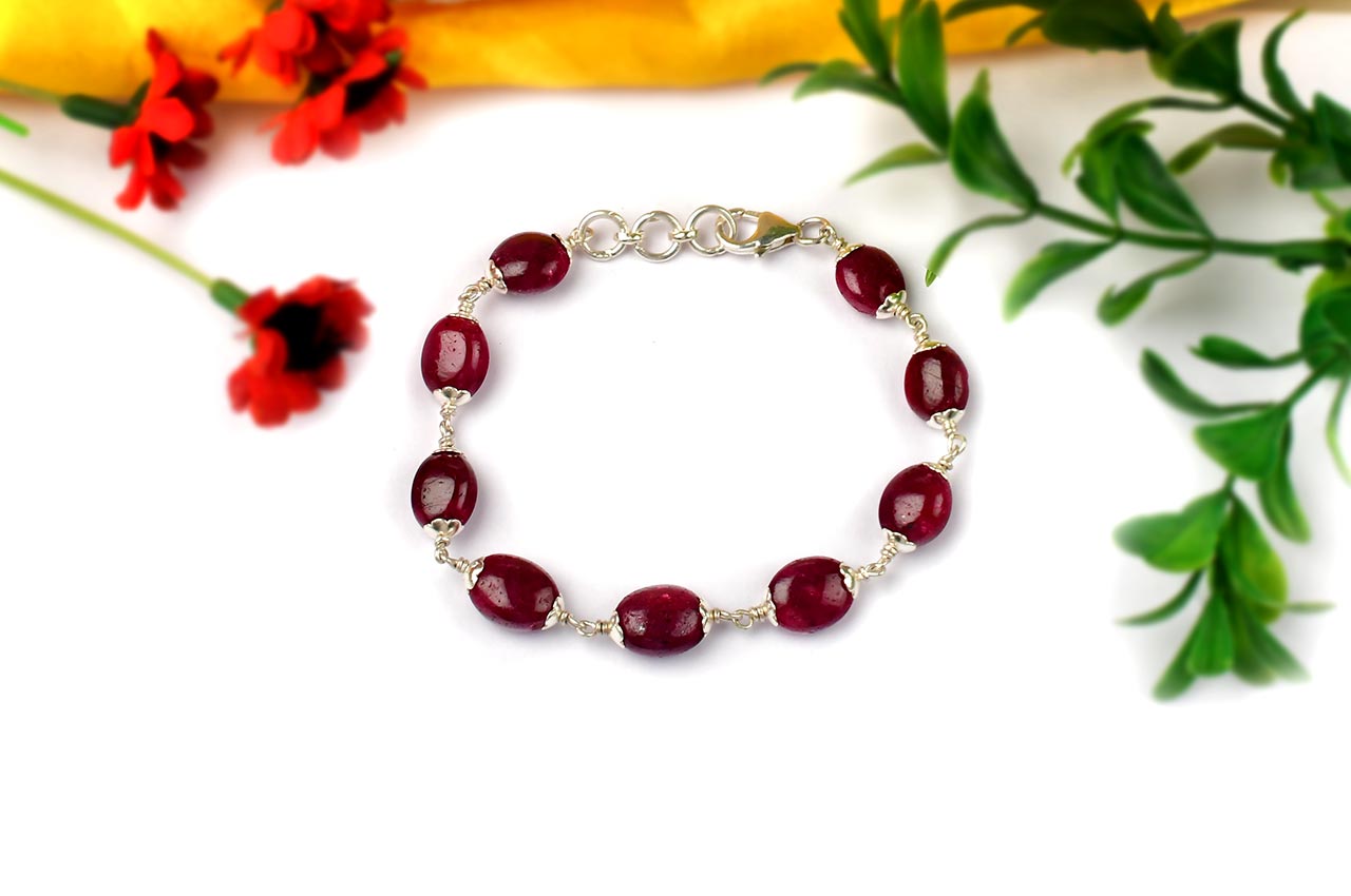 Ruby Oval Beads in Silver Flower Caps Bracelet