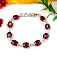 Ruby Oval Beads in Silver Flower Caps Bracelet